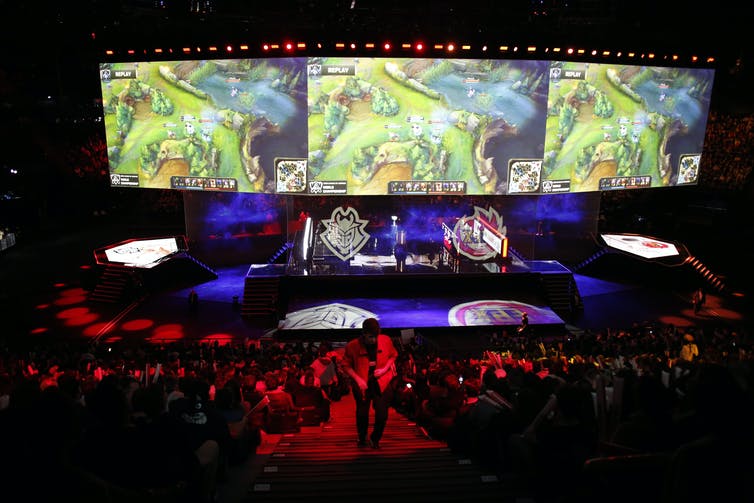 An arena full of people watching an international videogame tournament