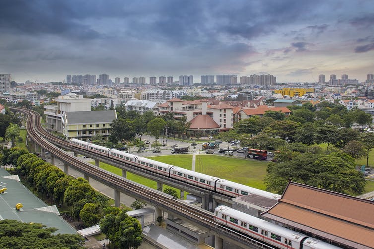 A view of Singapore's skyline with a mass rapid transit station in the foreground.