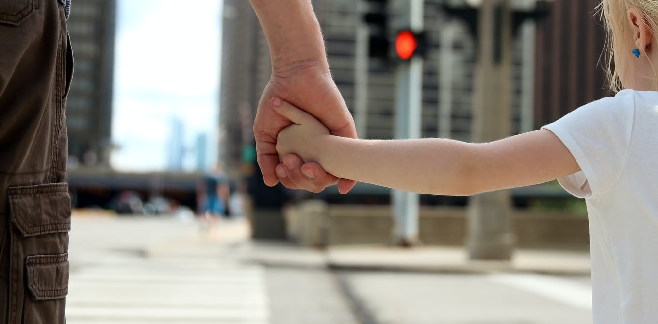 Linking self-driving cars to traffic signals might help pedestrians give them the green light