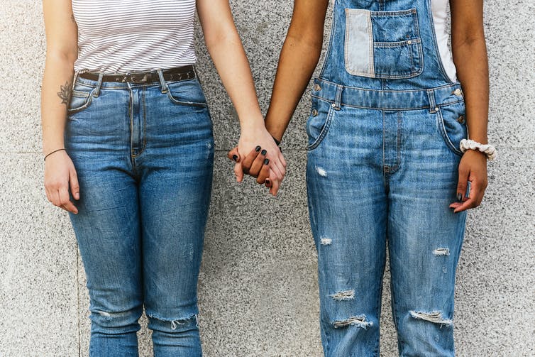 Two people holding hands.