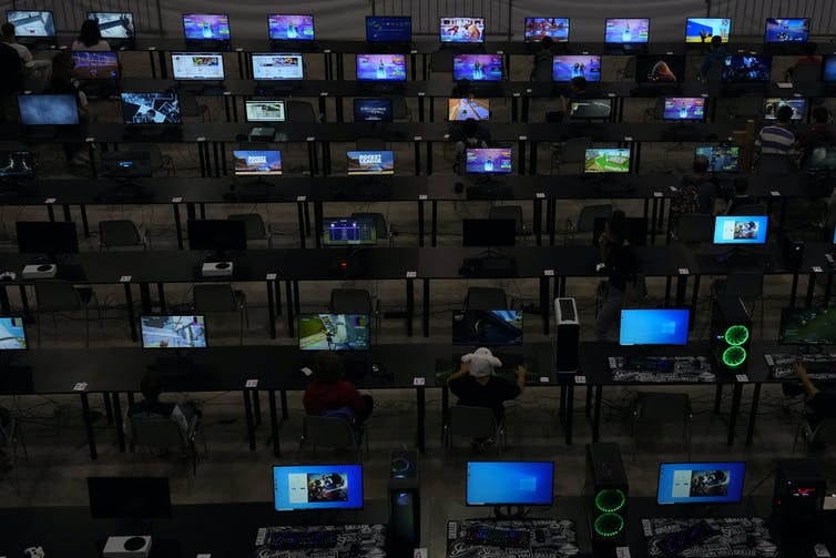 Children play video games at Romics fair in Rome, an international festival of comics, animation, cinema and games.