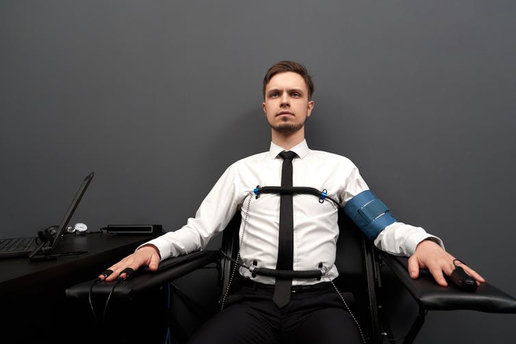 Man taking a lie detector test.