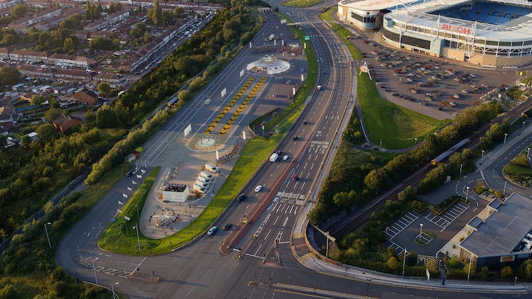 Launch pad with small runways surrounded by houses, roads and a stadium.