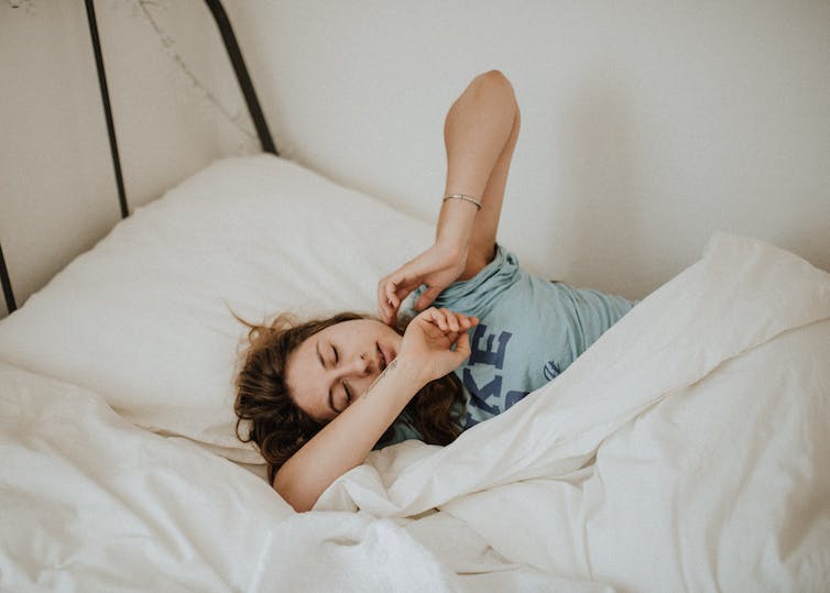 A woman laying in bed