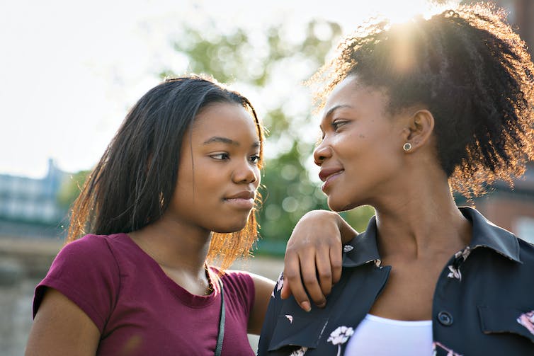 A mom and teen daughter.