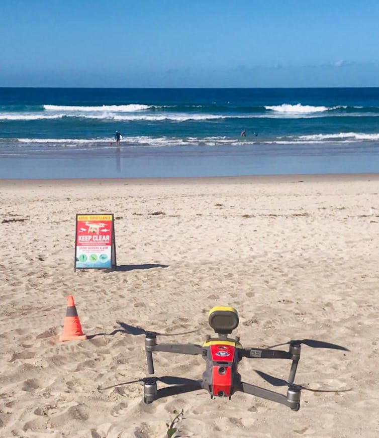 Drone flying at a beach.