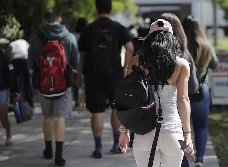 Students seen walking on a campus