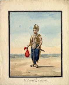 A male figure wearing a crown and holding a red bag in one hand.