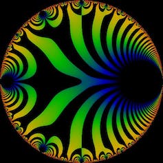 A circle containing curving black stripes against other colors, mostly yellow, green, and blue.