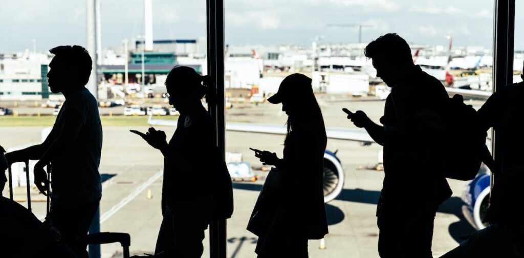 Why can't I use my phone or take photos on the airport tarmac? Is it against the law?