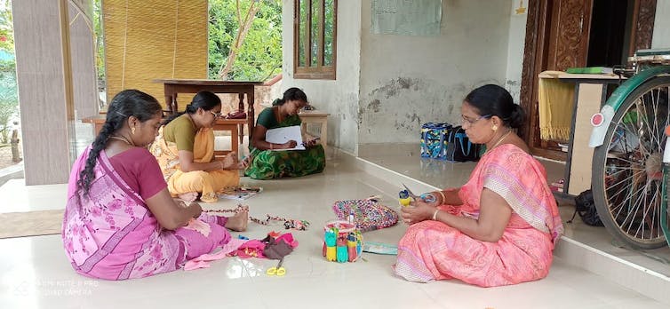 FIN staff members discussing a campaign for women's empowerment.