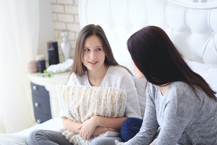 Girl talking to her mother