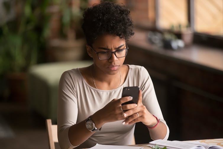 Woman looking at her smartphone.