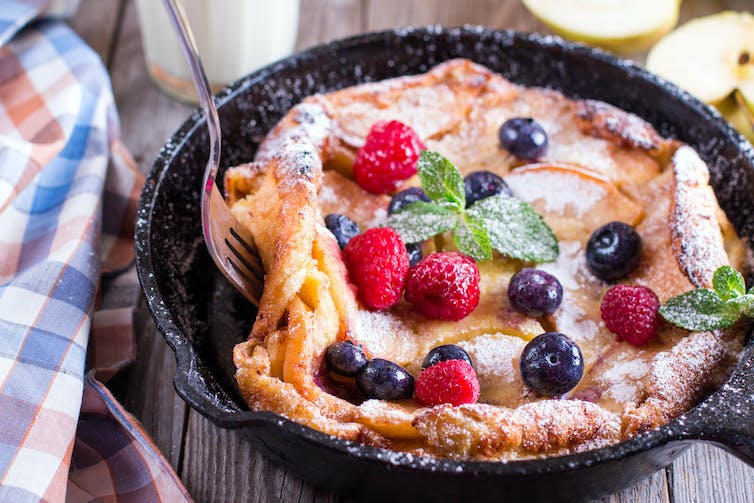 a pancake covered in berries