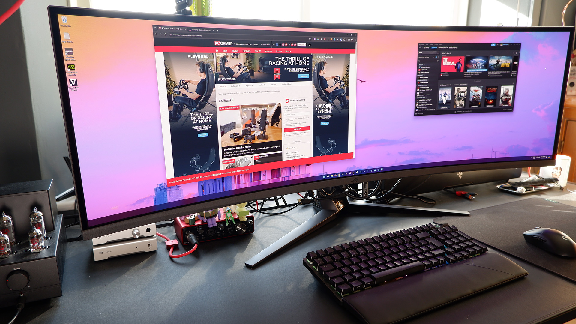 The Asus ROG Swift OLED PG49WCD set up on a gaming desk.