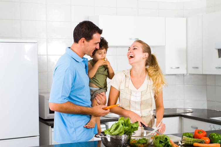 Family of three in kitchen