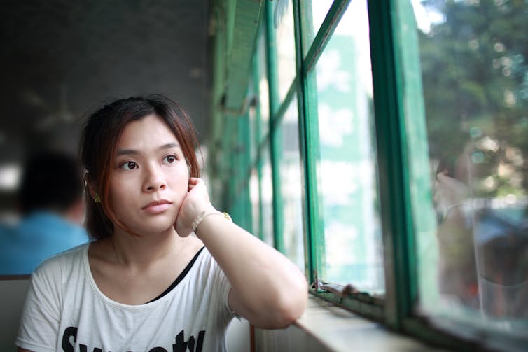 Woman staring into space.