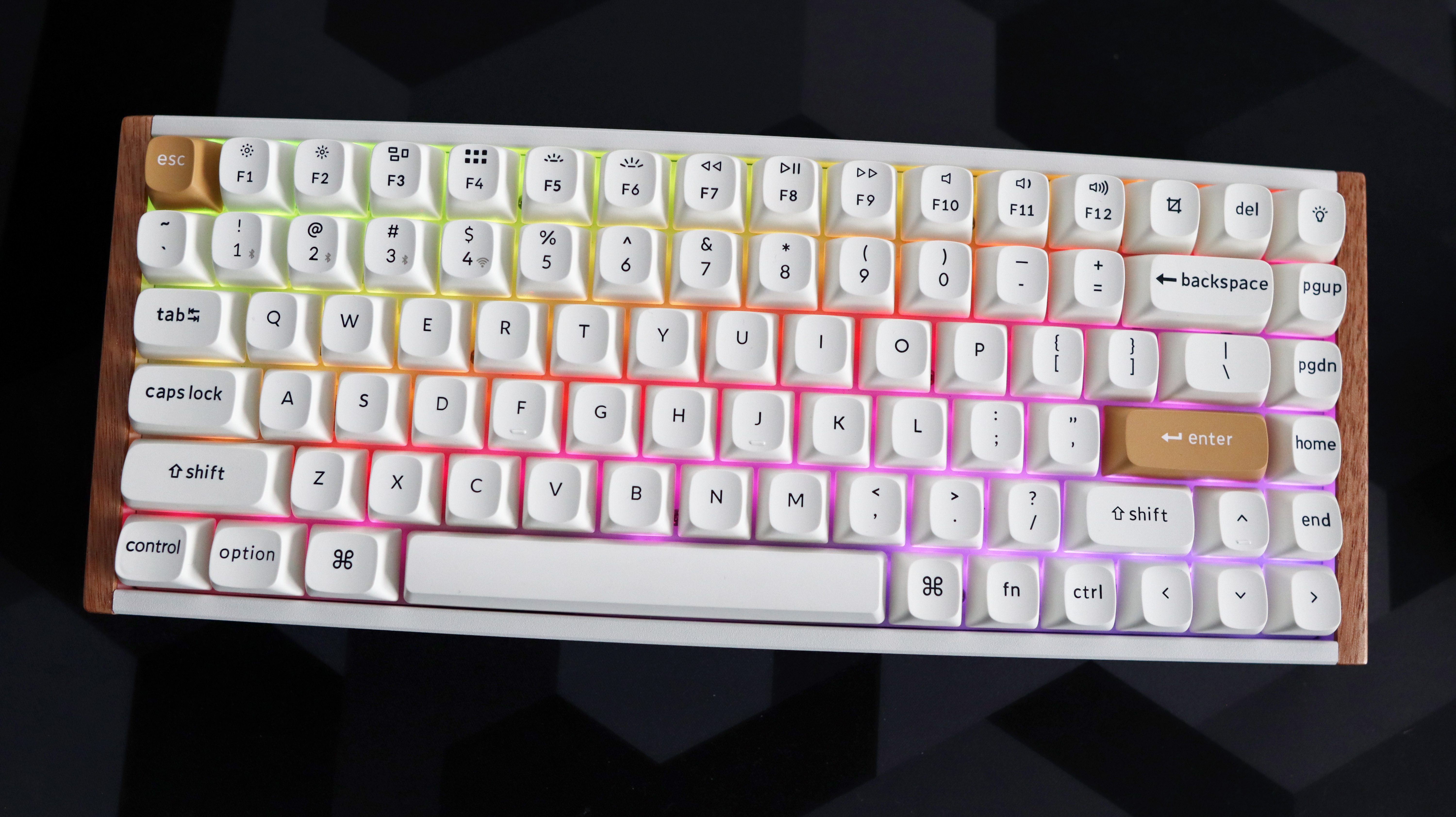 A Keychron K2 HE gaming keyboard with a wood finish and white keycaps with RGB enabled.