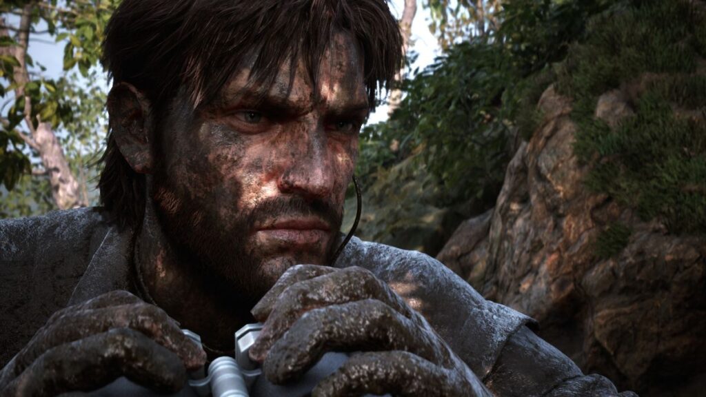 A close-up of Naked Snake's camouflaged face.