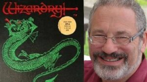 Wizardry co-creator Andrew Greenberg, now deceased, smiling next to the box art of the original game for the Apple II