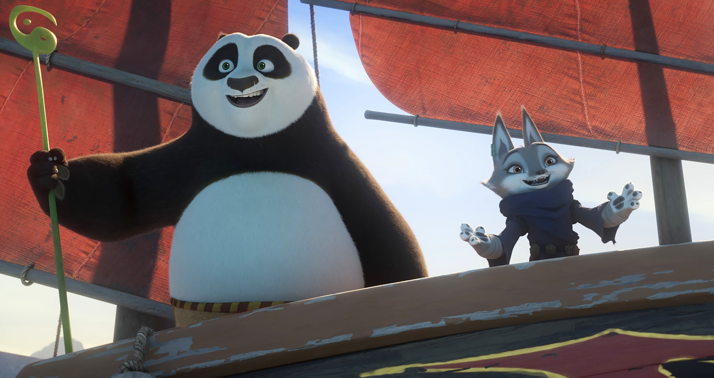 Po the panda (Jack Black) and Zhen the gray fox (Awkwafina) stand on the deck of a ship, both open-mouthed-smiling, in Kung Fu Panda 4