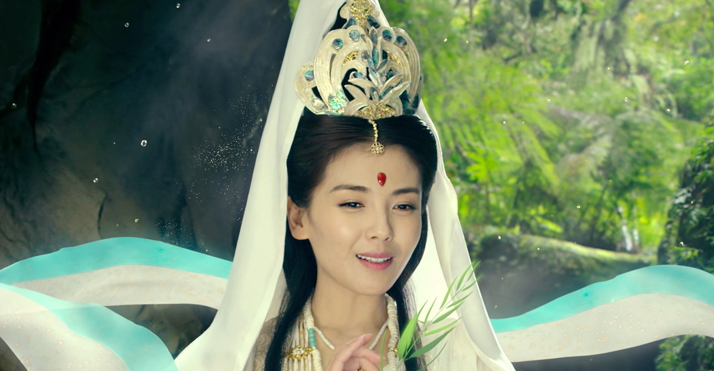 A woman with a headdress sits in the forest in The Monkey King 3 