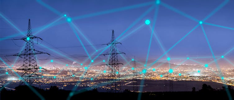 night sky with pylons and electric blue lines over dark city skyline