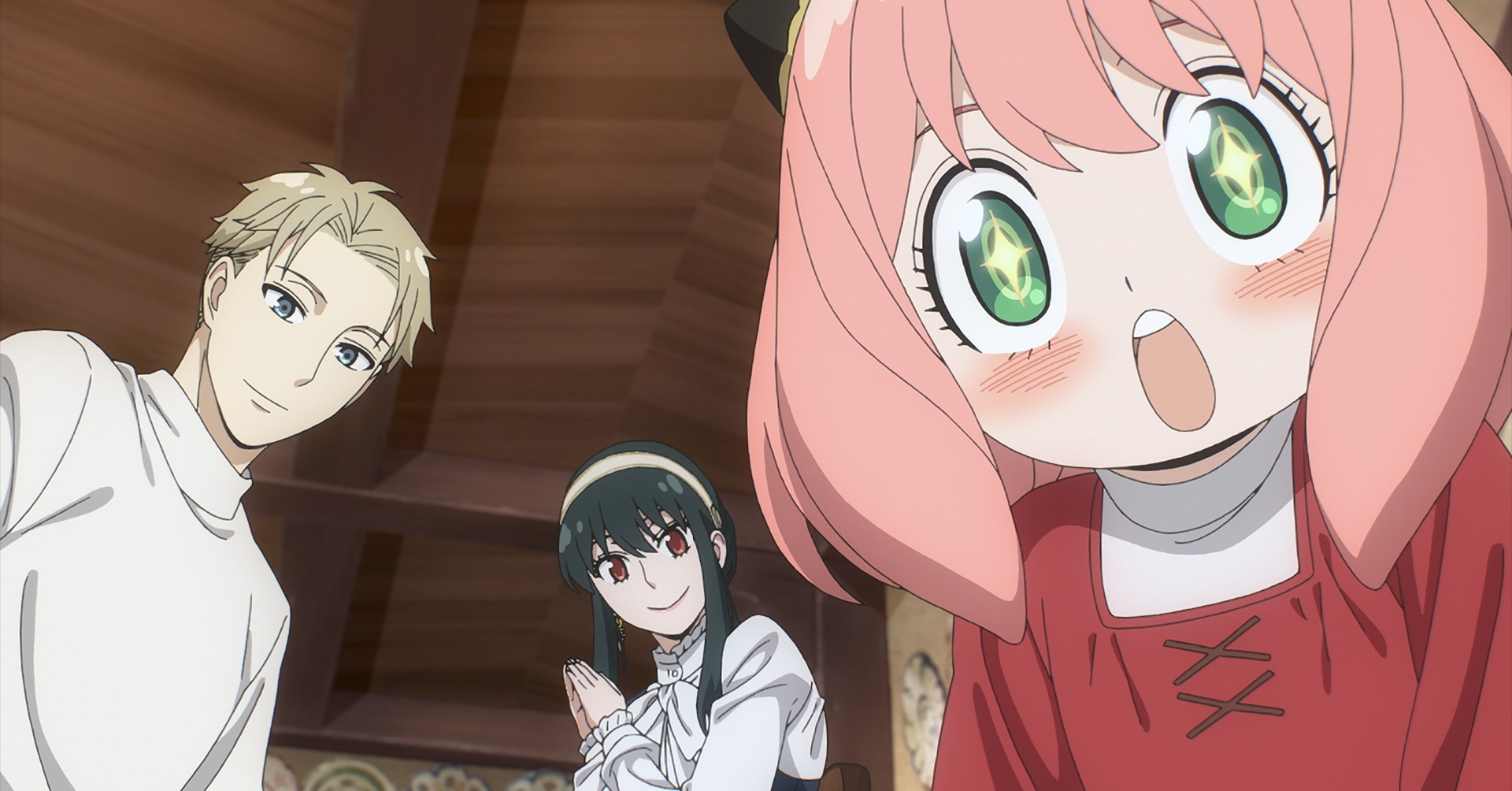 A bright-eyed anime girl with pink hair looks down beside two other smiling anime characters in Spy x Family Code: White.