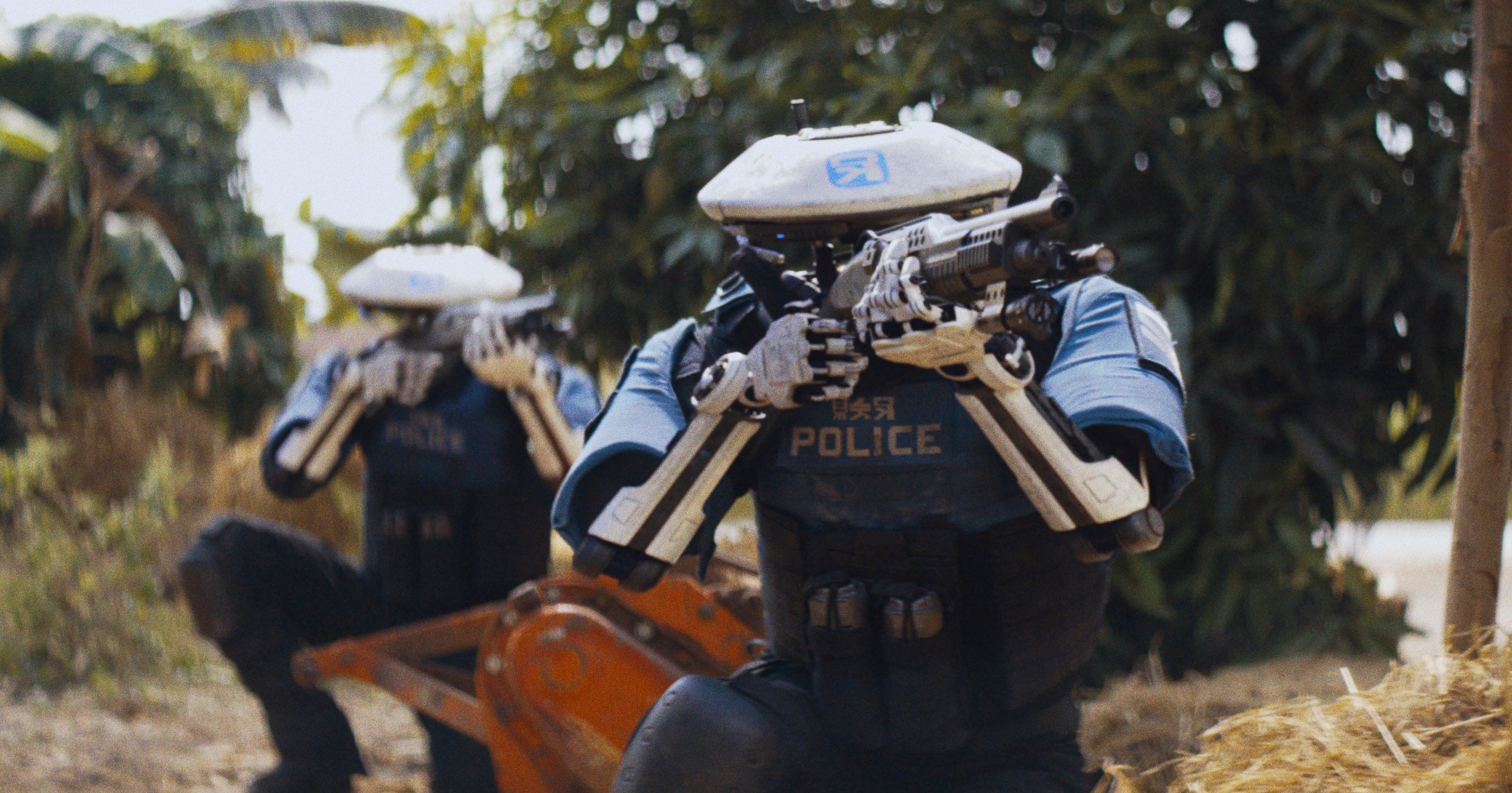 Two robot police officers, crouching in a tropical locale, aim shotguns in The Creator.