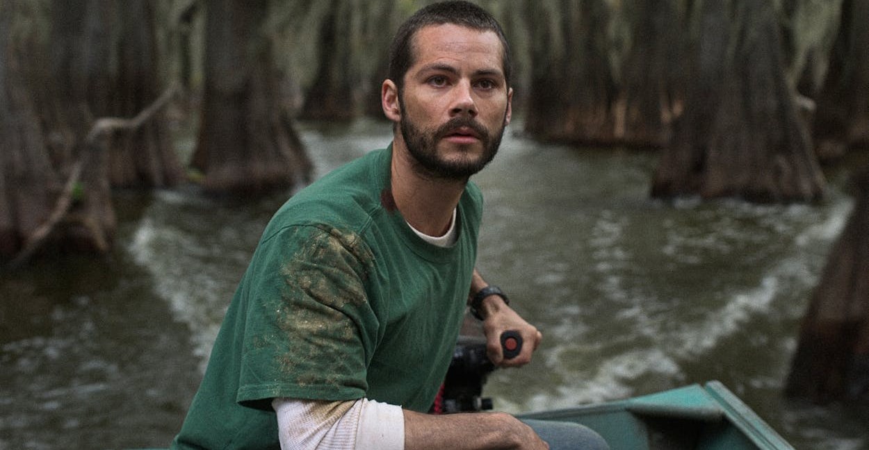 Dylan O’Brien piloting a motorboat in Caddo Lake.