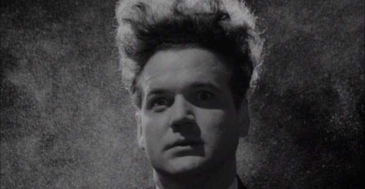 Jack Nance as Henry Spencer, a man with long flowing hair in Eraserhead.